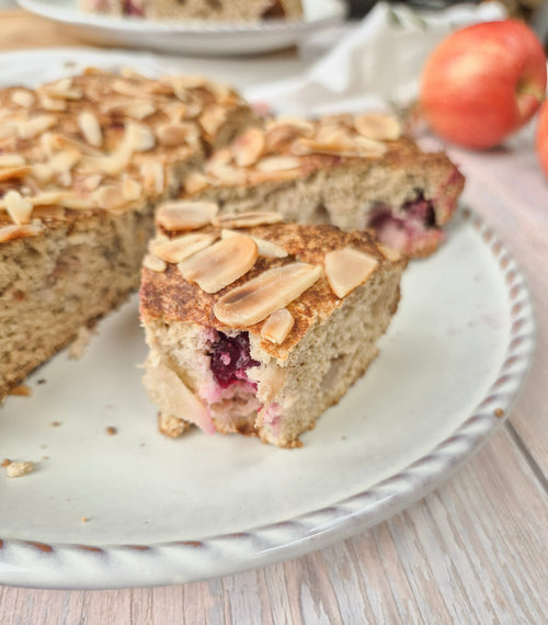 Homemade gluten-free apple cranberry cake sliced on a plate made with ReWild CoreBake