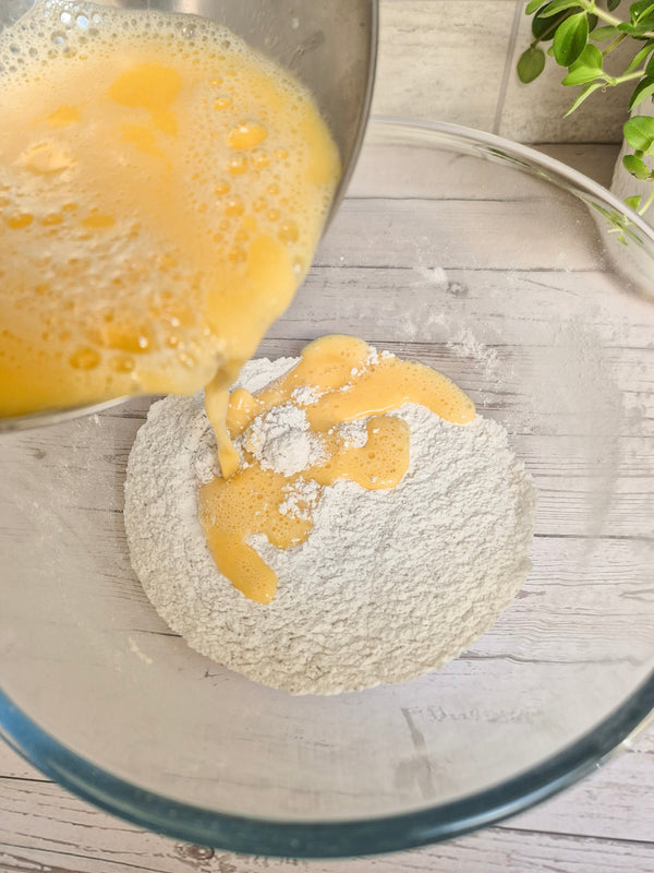 Step 3 – Adding wet ingredients to gluten-free babka flour mixture using ReWild CoreBake