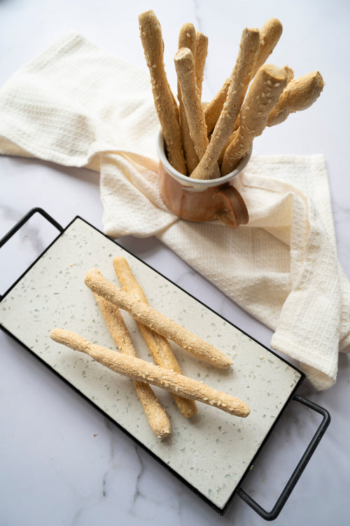 Low-carb gluten-free breadsticks topped with seeds made with ReWild CoreBake