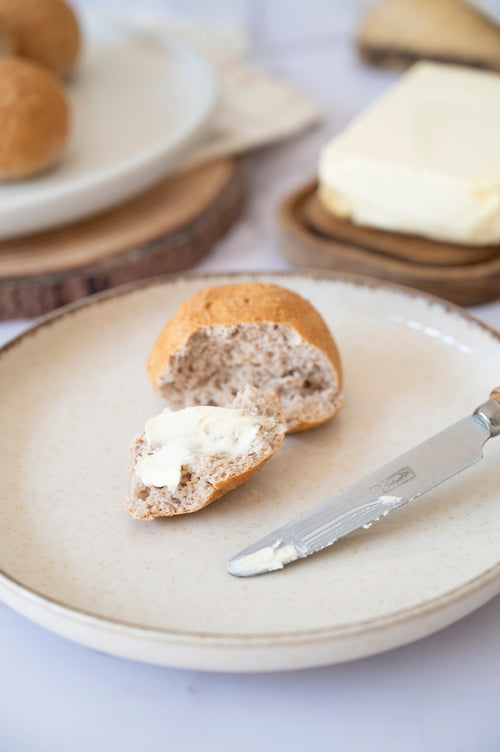 Gluten-free dinner rolls served on a plate made with ReWild CoreBake