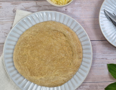 Gluten-free pizza dough base baked and ready for topping made with ReWild CoreBake