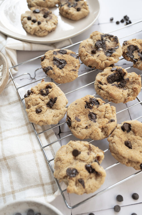 High-fibre gluten-free chocolate chip cookies cooling on a rack made with ReWild CoreBake flour blend