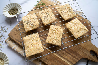 Homemade low-carb gluten-free crackers cooling on a rack made with ReWild CoreBake