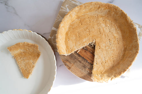 Baked low-carb gluten-free pie crust made with ReWild CoreBake with a slice