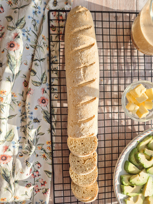Whole low-carb gluten-free bread loaf on a cooling rack made with ReWild CoreBake