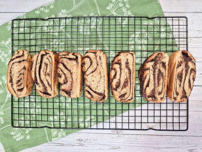 Low-carb gluten-free chocolate babka slices on a cooling rack made with ReWild CoreBake