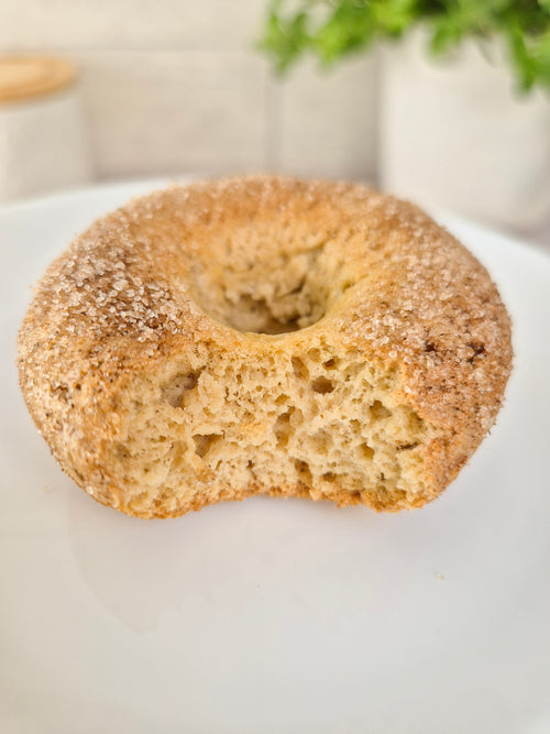 Low-carb gluten-free cinnamon sugar donut with a bite made with ReWild CoreBake