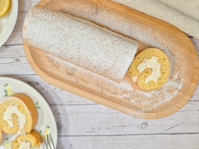 Low-carb gluten-free lemon Swiss roll dusted with powdered sweetener made with ReWild CoreBake