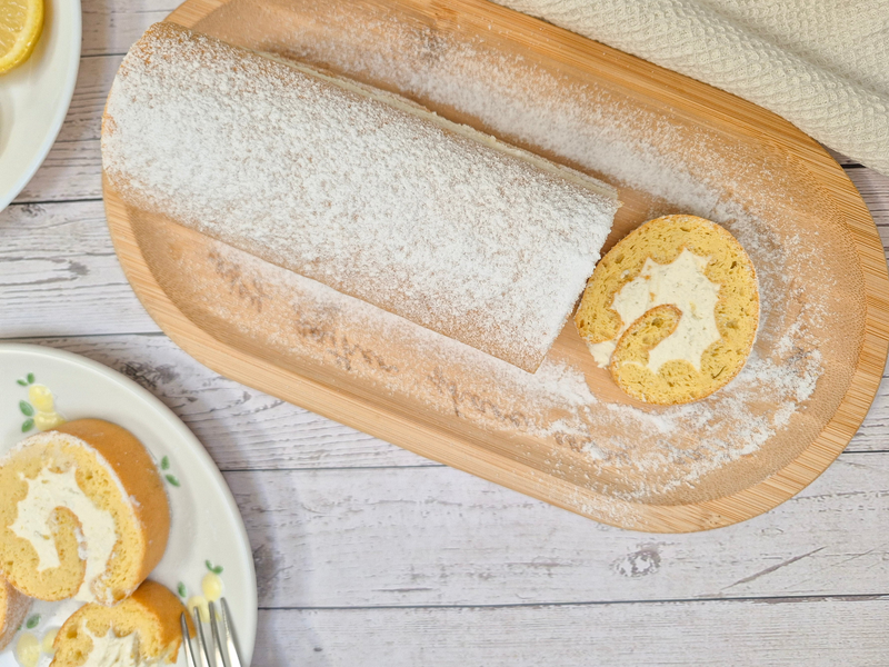 Low-carb gluten-free lemon Swiss roll dusted with powdered sweetener made with ReWild CoreBake