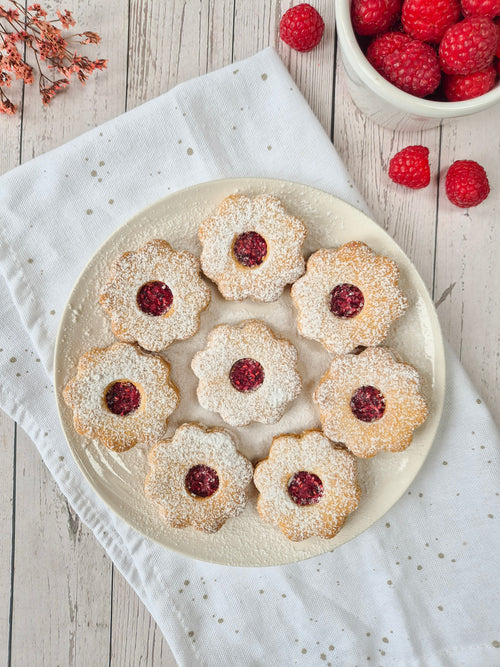Homemade low-carb gluten-free Linzer cookies filled with raspberry jam made with ReWild CoreBake