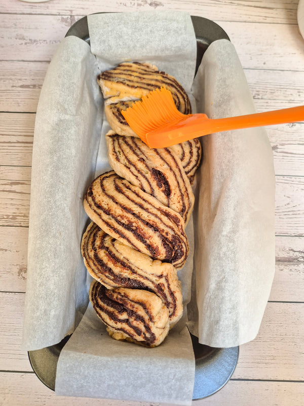 placing-babka-braid-into-loaf-tin-rewild-corebake