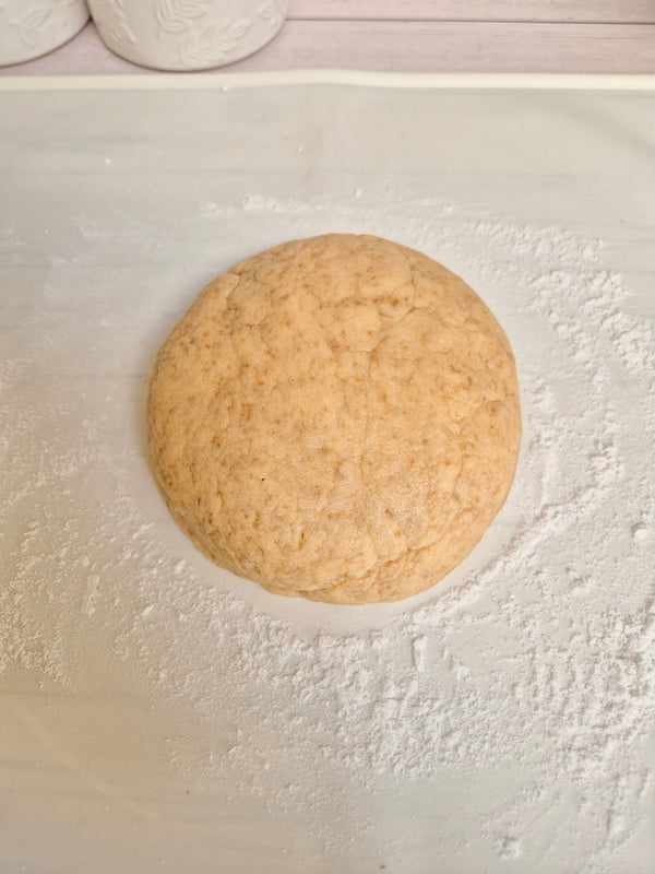 Step 6 – Resting gluten-free babka dough ball on a floured surface made with ReWild CoreBake