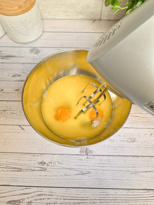Step 2 – Whisking eggs for gluten-free chocolate babka dough made with ReWild CoreBake